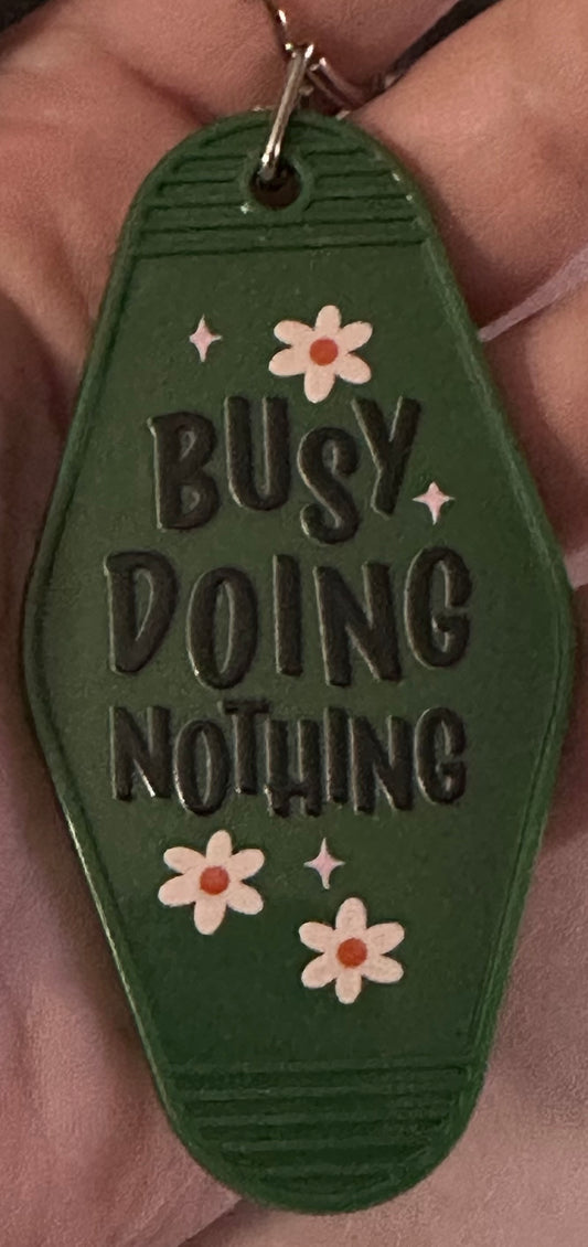 Busy Doing Nothing Motel Keychain